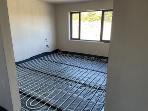 underfloor heating pipes being installed